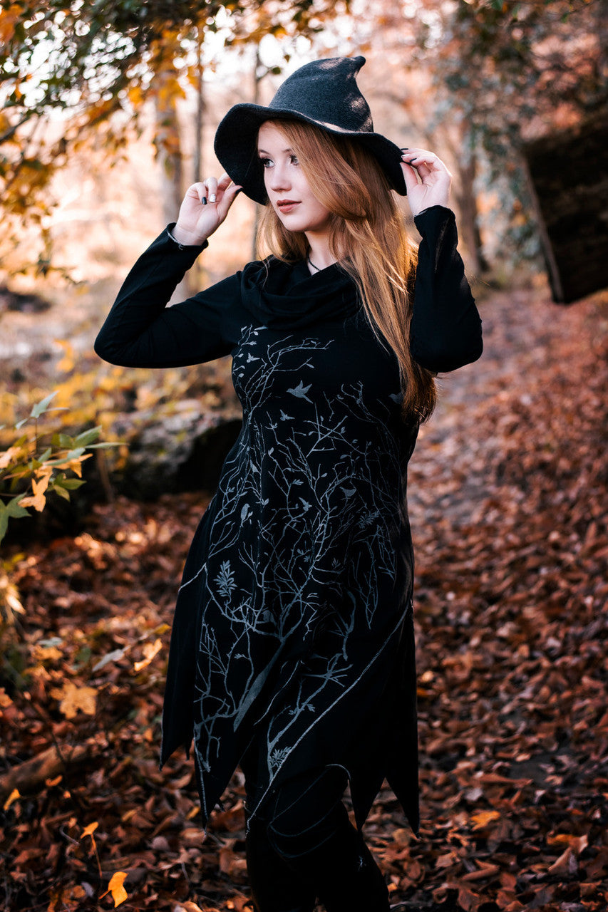 Long asymmetrical cowl neck dress with a bird and tree branch print.