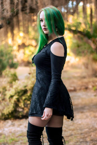 Occultist Dress, a witchy style long sleeve mini dress with lace accents, open shoulders, and a lace up chest, side view