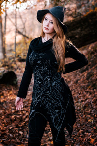 Long asymmetrical cowl neck dress with a bird and tree branch print.