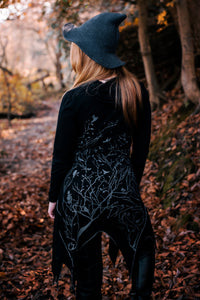 Long asymmetrical cowl neck dress with a bird and tree branch print.