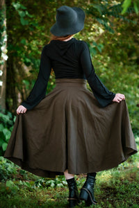 Forager Skirt in Olive Brown, back view with skirt held out